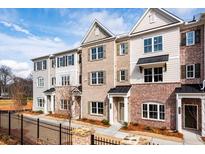 Modern townhome complex featuring brick facades, neutral colors, and inviting architectural details at 4818 Floydwood Ln, Mableton, GA 30126