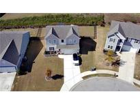 Aerial view of the home, highlighting its spacious yard, modern architecture, and inviting curb appeal at 60 Cottontail Lane, Villa Rica, GA 30180