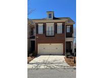 Charming two-story brick townhome with a two car garage and balcony at 1111 Newpark View Pl, Mableton, GA 30126