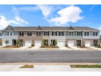 Charming townhomes with attached garages and welcoming curb appeal offer convenient living and modern design at 2520 Coventry Street, Atlanta, GA 30331