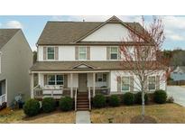 Charming two-story home with a welcoming front porch and manicured landscaping at 305 Parc Xing, Acworth, GA 30102