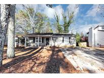 Charming single-story home with a well-maintained front yard and concrete driveway at 4275 Ridgetop Dr, Ellenwood, GA 30294