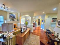 View of open-concept living room featuring hardwood floors and abundant natural light at 1349 Orchard Park Dr, Stone Mountain, GA 30083