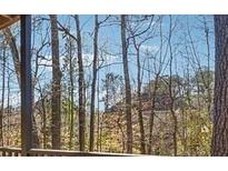 Scenic view of trees from the property, offering a sense of privacy and connection with nature at 408 River Run Dr, Atlanta, GA 30350