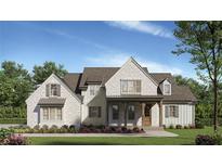 Charming two-story home with brick exterior, covered porch, and well-manicured lawn at 105 Dallas Mark Drive, Canton, GA 30115