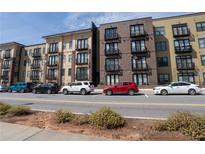 Modern condo building with street parking and attractive architecture at 5300 Peachtree Rd # 3506, Chamblee, GA 30341