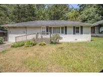 Charming single-story home with well-maintained lawn and inviting walkway to the front door at 1703 Derrill Dr, Decatur, GA 30032