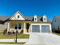 Charming home with a two-car garage, manicured lawn, and lovely curb appeal at 2785 Lifford Way, Duluth, GA 30097