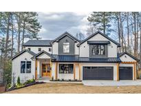 Beautiful two-story home with modern farmhouse architecture, a two-car garage, and manicured landscaping at 2179 Marann Ne Dr, Atlanta, GA 30345