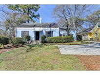 Charming blue single-story home featuring a manicured front yard and classic architectural details at 1926 N Decatur Ne Rd, Atlanta, GA 30307