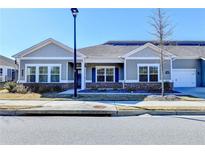 Charming single story home featuring manicured lawn, inviting curb appeal, and an attached two car garage at 2908 Rambler Dr, Loganville, GA 30052