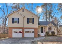 Charming two-story home with a brick-accented facade and attached two-car garage at 3619 Spring Leaf Ln, Acworth, GA 30101