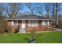 Charming brick home with a well-maintained lawn and inviting front entrance, perfect for a Gathering at 1160 Kathryn Cir, Forest Park, GA 30297
