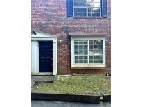 Charming brick home featuring blue shutters and a welcoming front entrance at 2574 Stratford Ln, Morrow, GA 30260