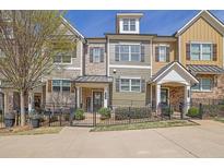 Charming townhomes featuring diverse exteriors and gated front yards at 318 Lantana Ln, Woodstock, GA 30188
