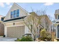 Charming home featuring a two-car garage and attractive architectural details and landscaping at 45 Mcevoy Ln, Decatur, GA 30030