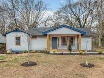 Charming single-story home with blue accents and a well-maintained front lawn at 2195 Burroughs Ave, Atlanta, GA 30315