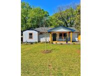 Charming single-story home featuring a well-maintained lawn and inviting exterior at 2195 Burroughs Ave, Atlanta, GA 30315