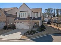 Beautiful two-story home featuring a two-car garage and well-maintained landscaping at 550 Onyx Lndg, Marietta, GA 30064
