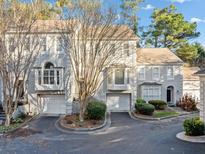 Charming townhome with a two-car garage, a well-maintained yard, and classic architectural details at 1532 Oak Grove Rd, Decatur, GA 30033