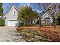 Charming single-Gathering home with a well-manicured lawn and attached two-car garage, offering curb appeal at 325 Whitley Park Dr, Atlanta, GA 30350