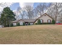 Charming ranch home with a well-manicured lawn and mature trees in a quiet neighborhood at 480 Firelite Ln, Suwanee, GA 30024
