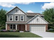 Charming two-story home with a brick and siding exterior, attached garage, and well-manicured lawn at 61 Okeechobee Way, Braselton, GA 30548