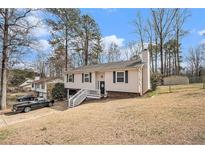 Charming home with a well-maintained yard and inviting entryway at 6355 Queens Rd, Douglasville, GA 30135