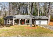 Charming single-story home featuring a welcoming front porch, neutral siding, and well-maintained landscaping at 4575 Jamerson Forest Pkwy, Marietta, GA 30066