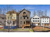 Charming new construction home with a covered porch and a well-manicured lawn at 115 Alcovy Ter, Alpharetta, GA 30009