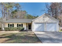 Charming single-story home with a well-manicured lawn, two-car garage, and inviting curb appeal at , Kennesaw, GA 30152