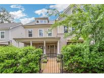 Charming two-story home featuring a welcoming front porch, well-maintained landscaping, and beautiful architectural details at 2239 Chestnut Pass, Decatur, GA 30033