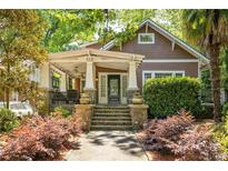 Charming Craftsman home with a inviting front porch and well-manicured landscaping at 313 5Th Ne St, Atlanta, GA 30308
