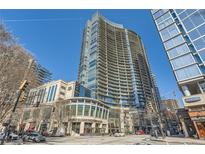 Striking exterior view of 1010 Midtown, an upscale high-rise condominium with balconies and vibrant street-level retail at 1080 Peachtree Ne St # 1812, Atlanta, GA 30309