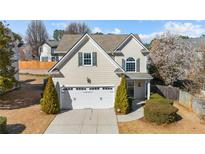 Charming two-story home featuring a two-car garage and well-maintained landscaping at 3102 Ballet Se Ct, Smyrna, GA 30082