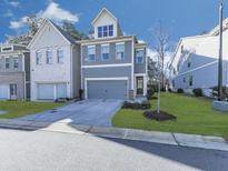 Charming, modern two-story home featuring a two-car garage, well-manicured lawn and beautiful blue siding at 1020 Broadview Dr, Marietta, GA 30062