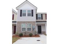 Charming two-story home with brick accents and a well-maintained front yard at 2526 Piering Dr, Lithonia, GA 30038