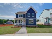 Charming two-story home with a welcoming front porch and well-manicured lawn at 4040 Andover Cir, Mcdonough, GA 30252