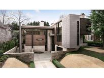 Stunning modern home featuring stone, wood, and metal accents with beautiful landscaping at 79 Beverly Ne Rd, Atlanta, GA 30309