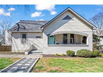 Charming bungalow with welcoming front porch, freshly painted, and professionally landscaped yard at 220 Mayson Ne Ave, Atlanta, GA 30307