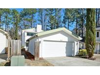 Charming townhome with an attached one-car garage and white siding at 2979 Grey Squirrel Se Ct, Marietta, GA 30067