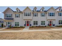 Charming townhomes with colorful doors, ample windows, and well-manicured lawns at 1840 Eastmore Ave, Conyers, GA 30094