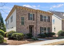 Charming brick two-story home with classic shutters and well-maintained landscaping at 771 Park Manor Se Dr, Smyrna, GA 30082