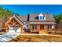 Charming craftsman-style home with a inviting porch and garage at 136 Rainey Rd, Temple, GA 30179