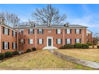 Charming brick apartment building with black shutters and a well-maintained lawn at 2367 Cascade Sw Rd # 9C, Atlanta, GA 30311