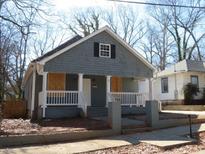 Charming bungalow-style home with a cozy front porch and shaker siding at 7 Whatley Se St, Atlanta, GA 30315