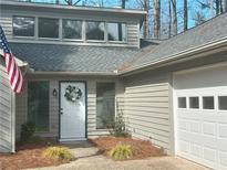 Charming home featuring an inviting entrance with a white front door and beautiful wreath detail at 3825 Emerson St, Marietta, GA 30062
