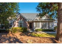 Beautiful one-story house with lush landscaping and a welcoming front entrance at 2406 Village Ln, Roswell, GA 30075
