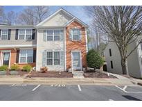 Charming townhouse with brick accents, inviting front door, and well-maintained landscaping at 1710 Kilmington Ct, Alpharetta, GA 30009