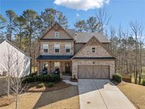 Charming two-story home featuring a brick and siding facade, well-maintained landscaping, and a two-car garage at 367 Reserve Overlook, Canton, GA 30115